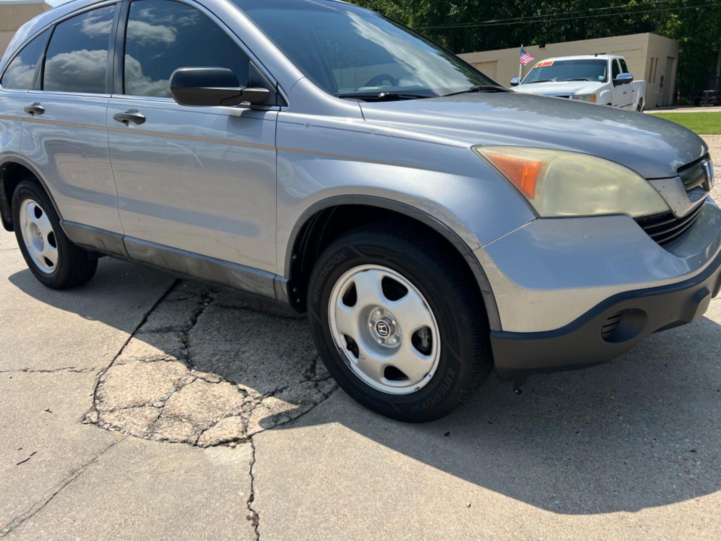 2008 Gray /Gray Honda CR-V LX (3CZRE383X8G) with an 2.4L 4 Cylinder engine, Automatic transmission, located at 4520 Airline Hwy, Baton Rouge, LA, 70805, (225) 357-1497, 30.509325, -91.145432 - 2008 Honda CR-V LX 2.4L 4Cylinder Gas Saver, Automatic, 158K Miles, Power Windows & Locks, Cold A/C, No Accidents But It Does Have A Dent On Drivers Door. FOR INFO PLEASE CONTACT JEFF AT 225 357-1497 CHECK OUT OUR A+ RATING WITH THE BETTER BUSINESS BUREAU WE HAVE BEEN A FAMILY OWNED AND OPERATED BUS - Photo#3